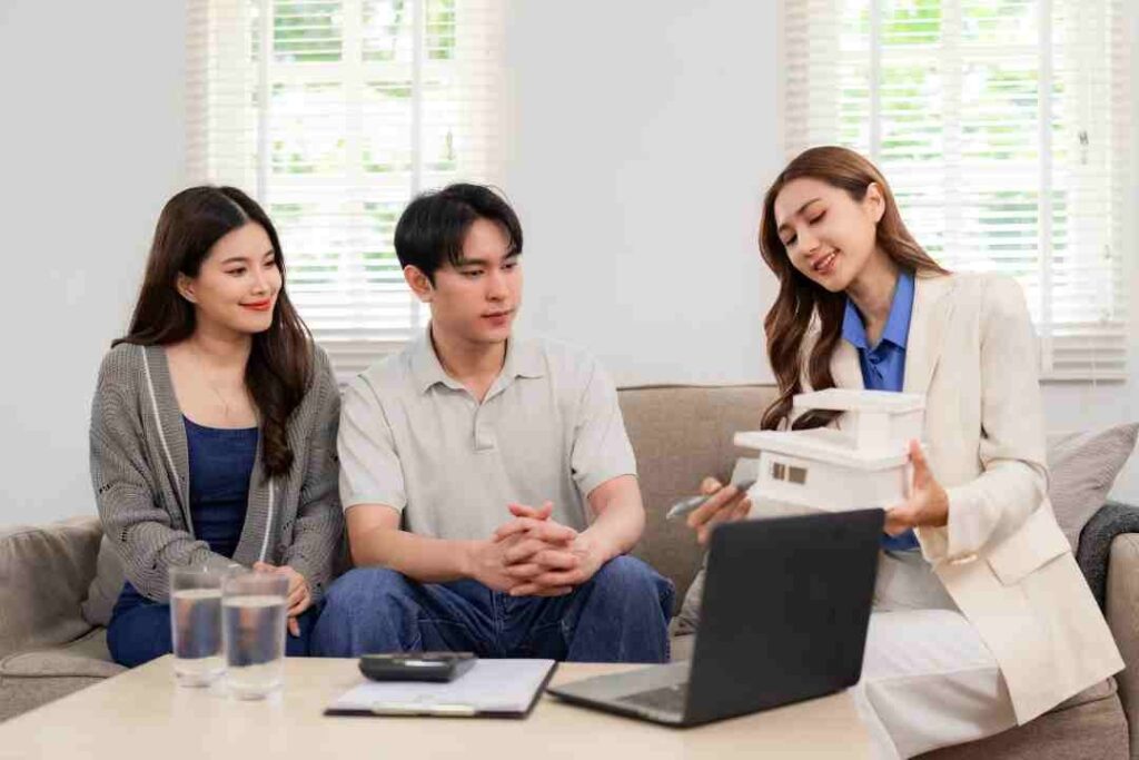 real-estate-agent-advises-home-buyer-on-property-investment-usin